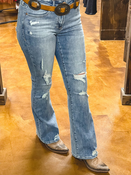 Dear John Rosa Elm Grove Flares are a High rise flare leg jean. It's the lovable fit that sits slightly lower on the waist and fitted skinny in the hips through the knee. Full inseam on comfort stretch denim accented with random tears & destructions, hand sanding hip whiskers, grindings on pocket & leg opening, tailor pressed seam lines.  9 1/2" Front Rise (include waistband), 21" Leg Opening, 32.5”  inseam (Size 27)